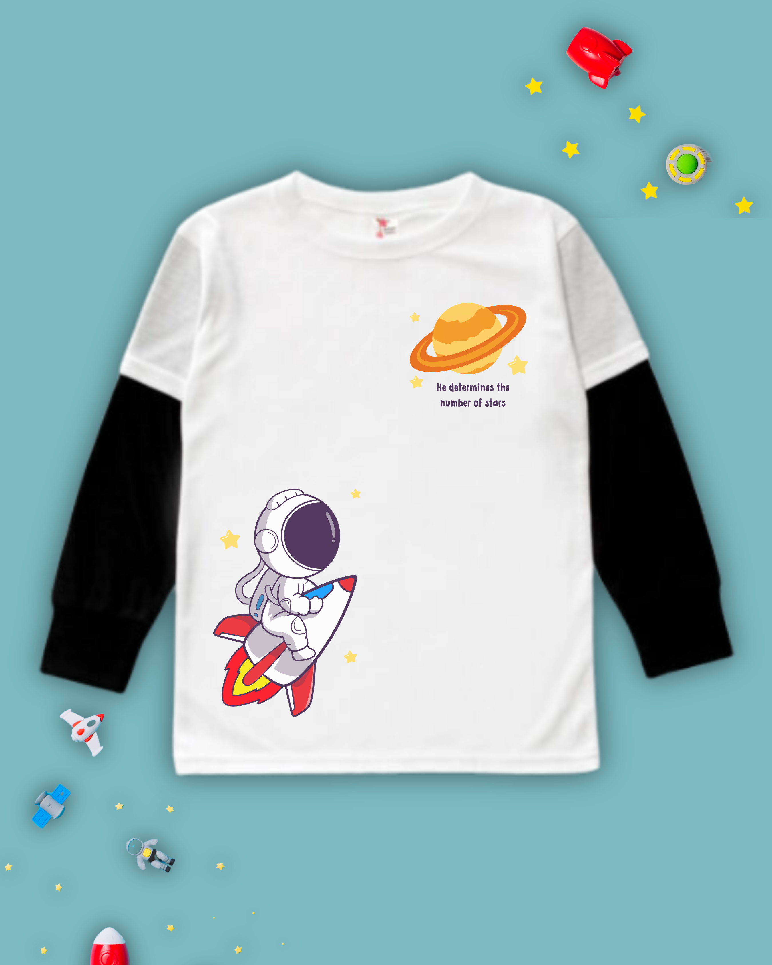 White kids Christian tshirt with black long sleeve undershirt decorated with an astranaut riding a rocket heading towards a planet with the words 'He determines the number of stars" under it.