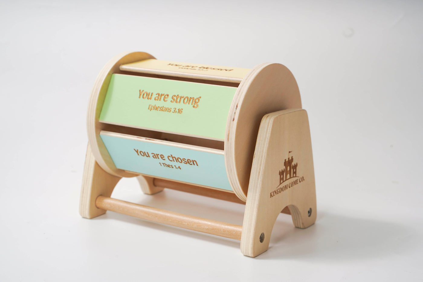 Montessori inspired wooden spinning drum where each panel on the drum features an affirmation bible verse.